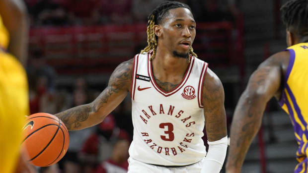Arkansas guard El Ellis looks for an opening in the defense against LSU.